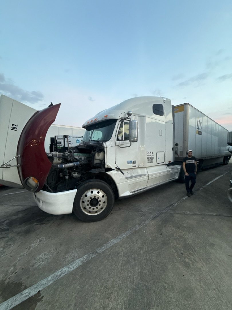 Freightliner Century with hood up, dusk light